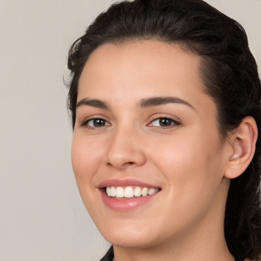 Joyful white young-adult female with medium  brown hair and brown eyes