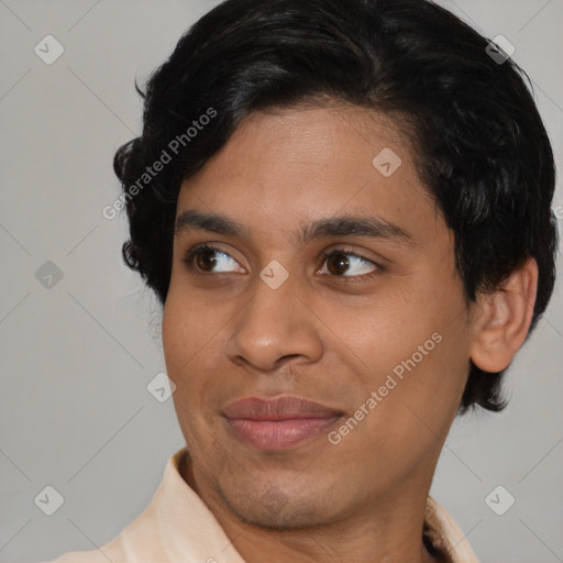 Joyful latino young-adult male with short  brown hair and brown eyes