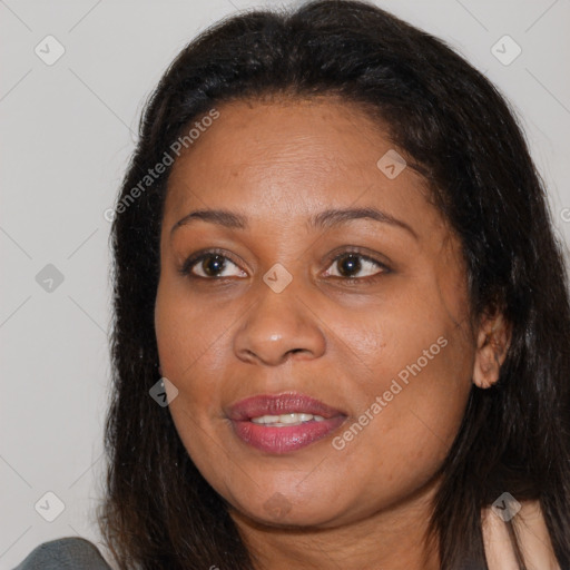 Joyful white adult female with long  brown hair and brown eyes