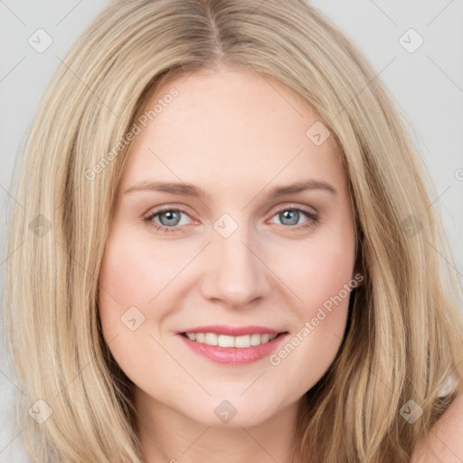 Joyful white young-adult female with long  brown hair and blue eyes