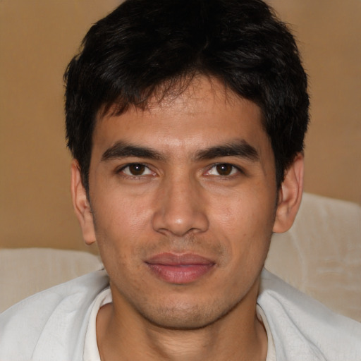 Joyful asian young-adult male with short  black hair and brown eyes