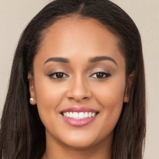 Joyful white young-adult female with long  brown hair and brown eyes