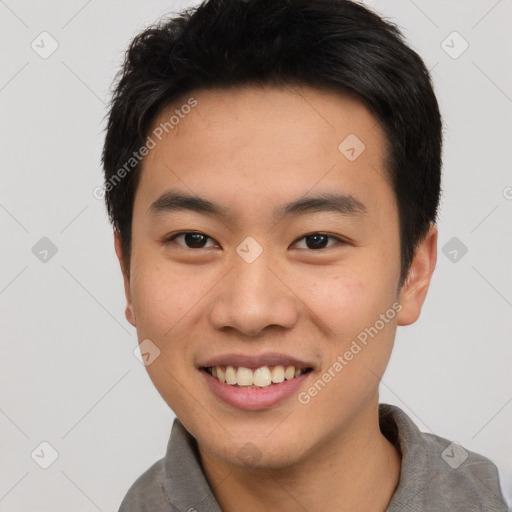 Joyful asian young-adult male with short  brown hair and brown eyes