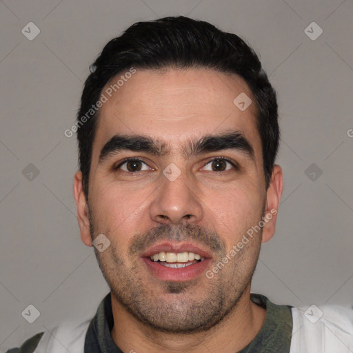 Joyful white young-adult male with short  black hair and brown eyes