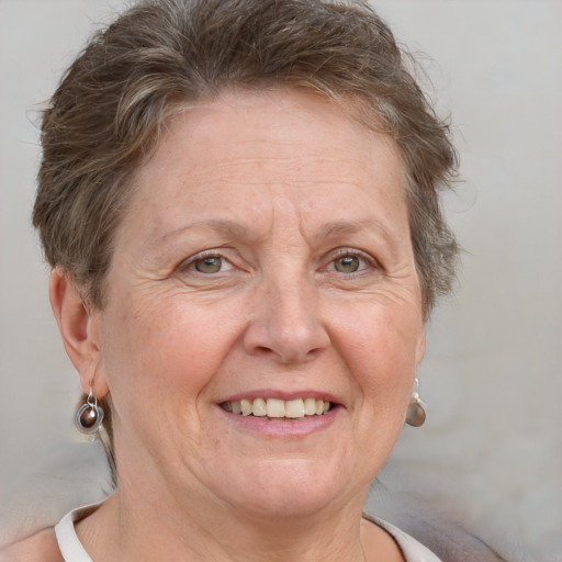 Joyful white middle-aged female with short  brown hair and brown eyes