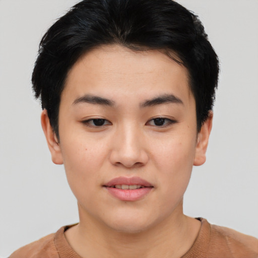Joyful asian young-adult female with short  black hair and brown eyes
