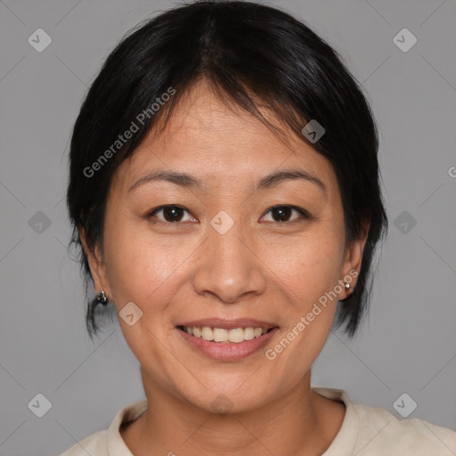 Joyful asian adult female with medium  brown hair and brown eyes