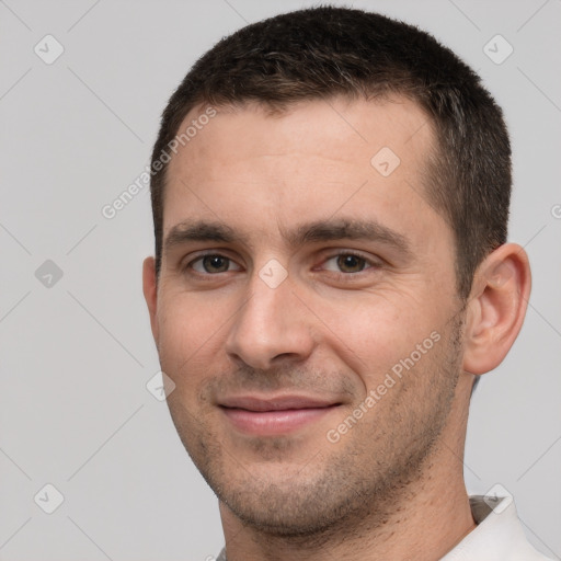 Joyful white young-adult male with short  brown hair and brown eyes