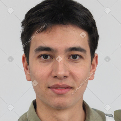 Joyful white young-adult male with short  black hair and brown eyes