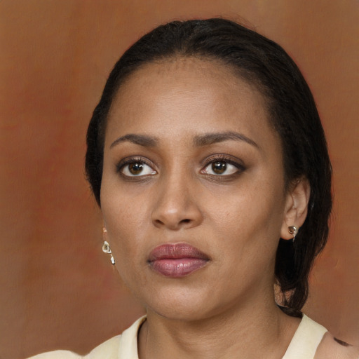 Neutral black young-adult female with medium  brown hair and brown eyes