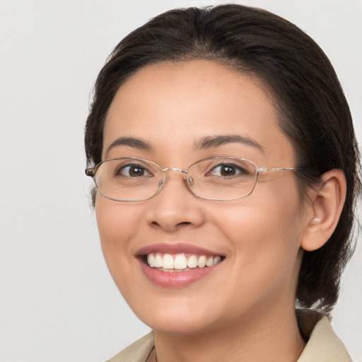 Joyful white young-adult female with medium  brown hair and brown eyes