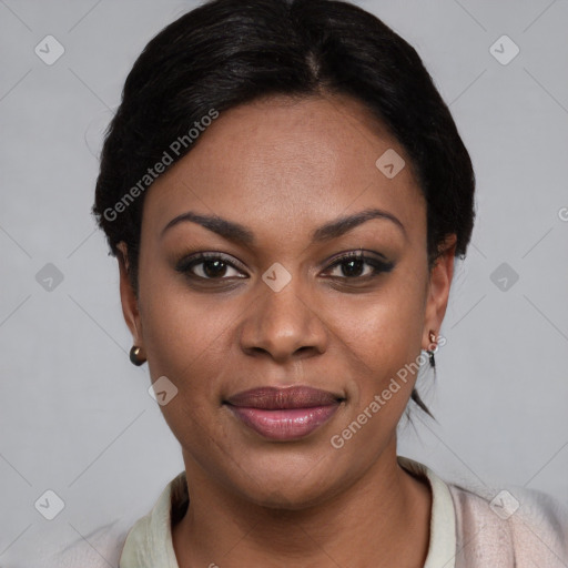 Joyful black young-adult female with short  black hair and brown eyes