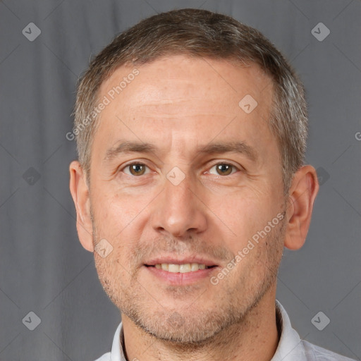 Joyful white adult male with short  brown hair and brown eyes