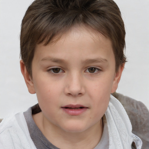 Joyful white child male with short  brown hair and brown eyes