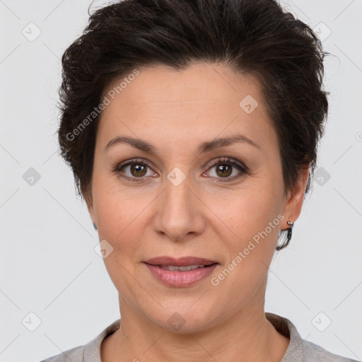 Joyful white adult female with short  brown hair and brown eyes