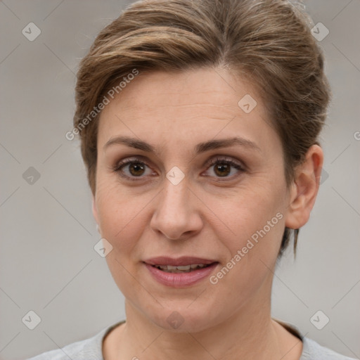 Joyful white adult female with short  brown hair and grey eyes