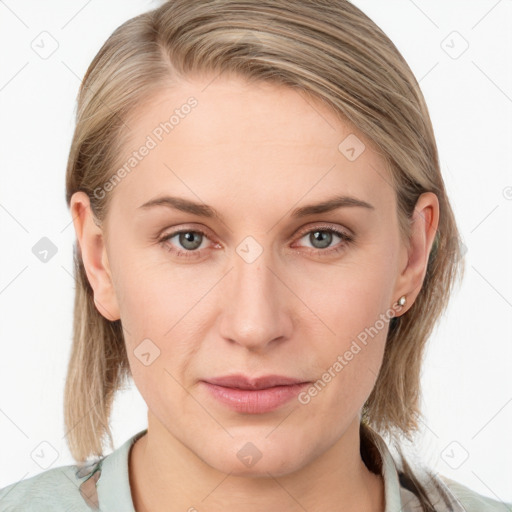 Joyful white young-adult female with medium  brown hair and blue eyes