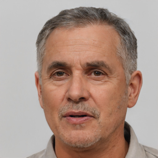 Neutral white middle-aged male with short  gray hair and brown eyes