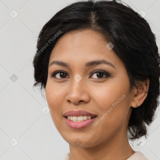 Joyful latino young-adult female with medium  brown hair and brown eyes