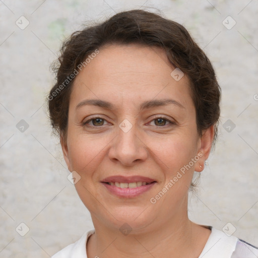 Joyful white adult female with short  brown hair and brown eyes