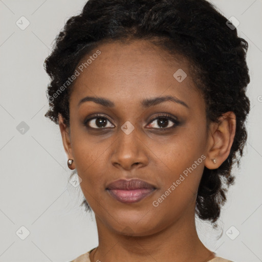 Joyful black young-adult female with short  black hair and brown eyes