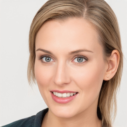 Joyful white young-adult female with medium  brown hair and blue eyes