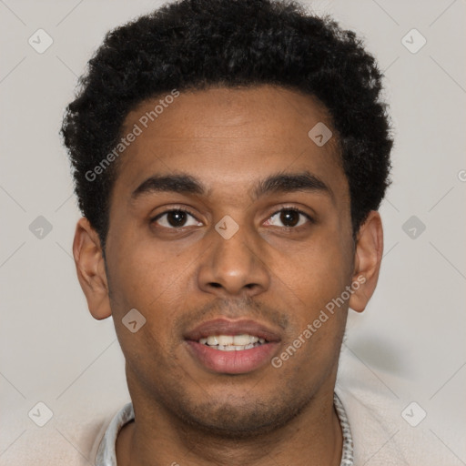 Joyful black young-adult male with short  black hair and brown eyes