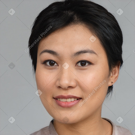 Joyful asian young-adult female with medium  black hair and brown eyes