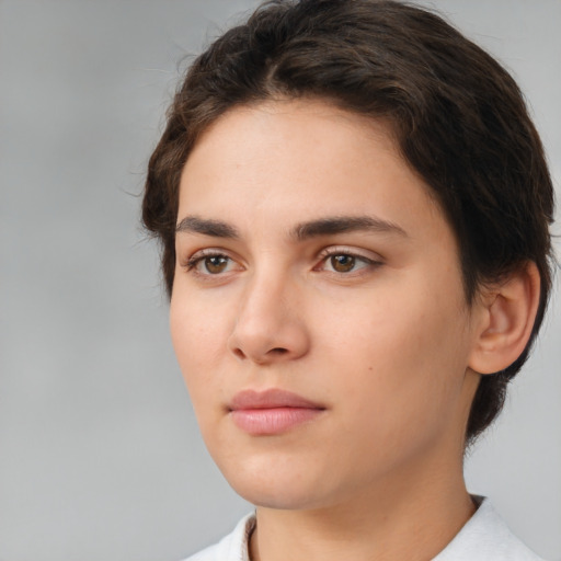 Neutral white young-adult female with short  brown hair and brown eyes
