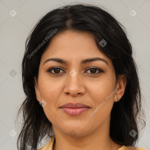 Joyful latino young-adult female with medium  brown hair and brown eyes