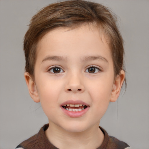 Joyful white child female with short  brown hair and brown eyes