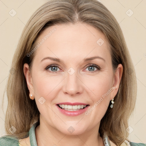 Joyful white adult female with medium  brown hair and grey eyes