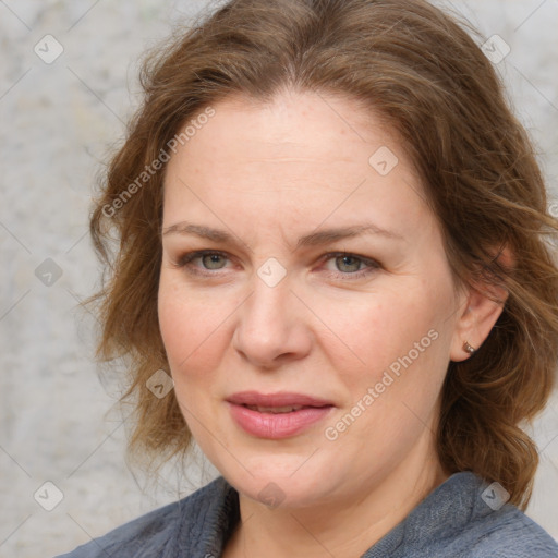 Joyful white young-adult female with medium  brown hair and blue eyes