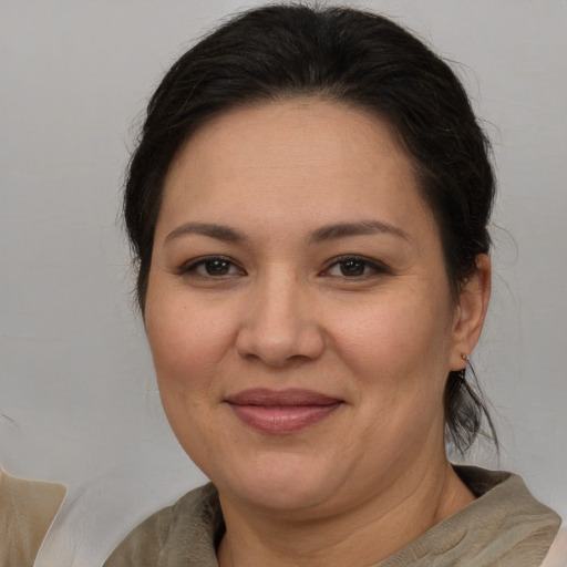 Joyful white adult female with medium  brown hair and brown eyes