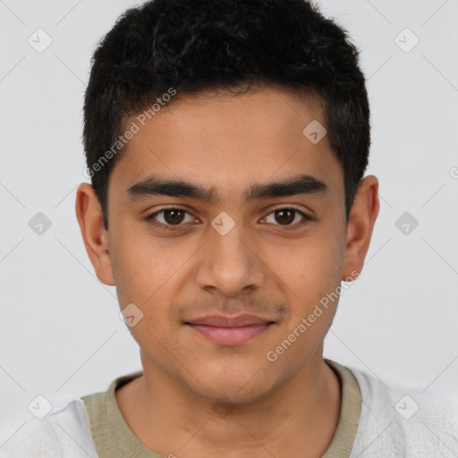 Joyful latino young-adult male with short  brown hair and brown eyes