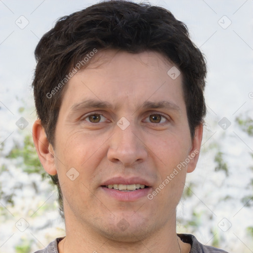 Joyful white adult male with short  brown hair and brown eyes