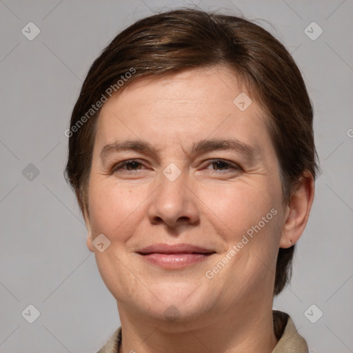 Joyful white adult female with medium  brown hair and grey eyes