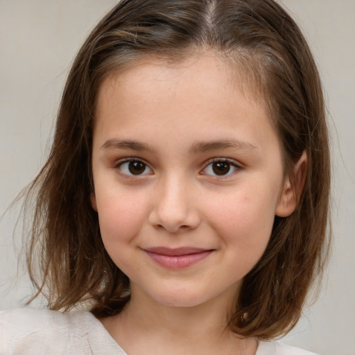 Joyful white child female with medium  brown hair and brown eyes