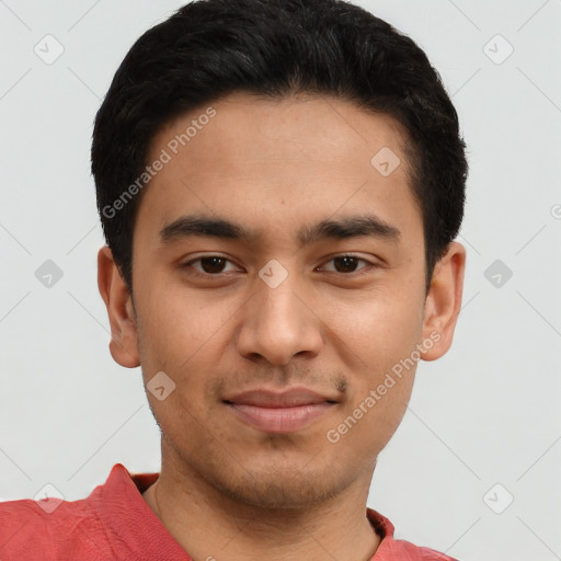 Joyful latino young-adult male with short  black hair and brown eyes