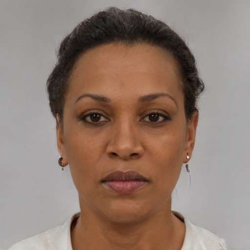 Neutral latino adult female with short  brown hair and brown eyes