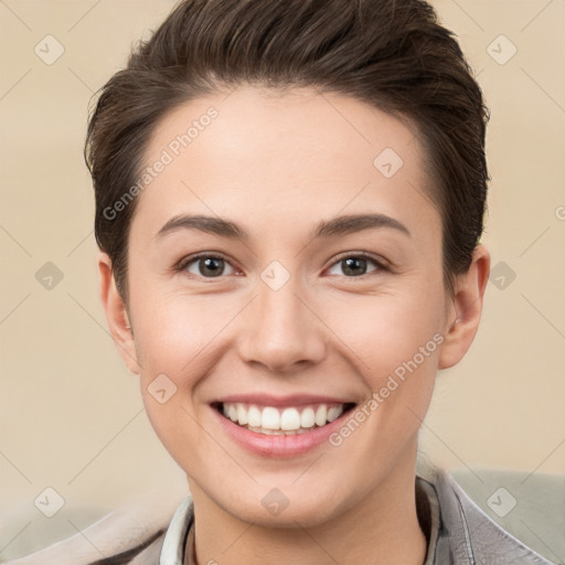 Joyful white young-adult female with short  brown hair and brown eyes