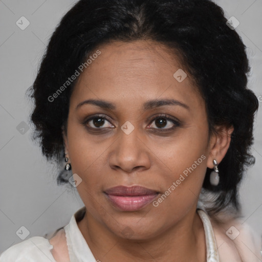 Joyful latino adult female with medium  brown hair and brown eyes