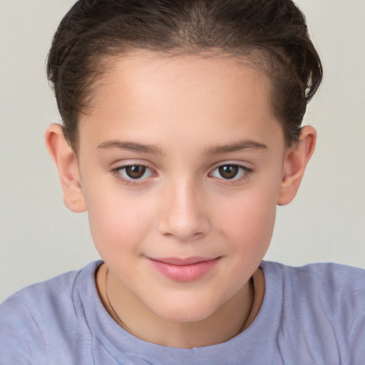 Joyful white child female with short  brown hair and brown eyes