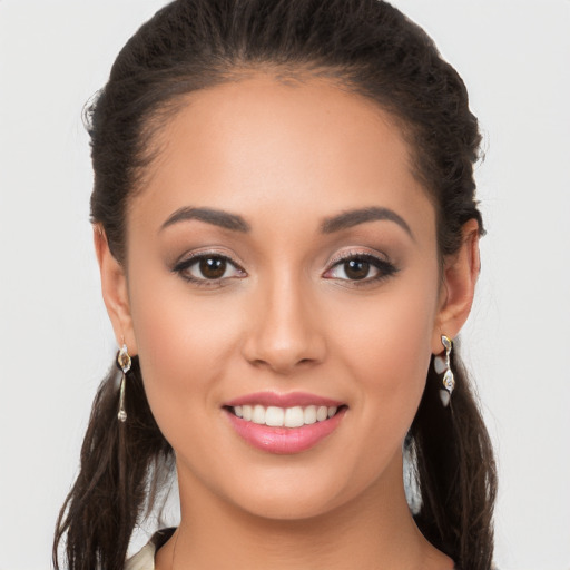 Joyful white young-adult female with long  brown hair and brown eyes