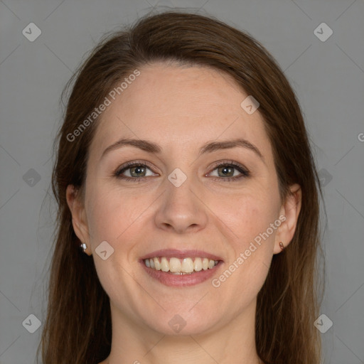 Joyful white young-adult female with long  brown hair and grey eyes