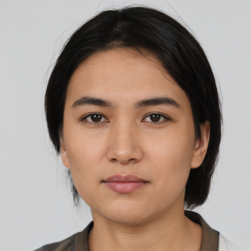 Neutral asian young-adult female with medium  black hair and brown eyes