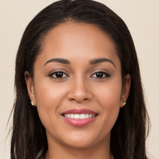 Joyful white young-adult female with long  brown hair and brown eyes