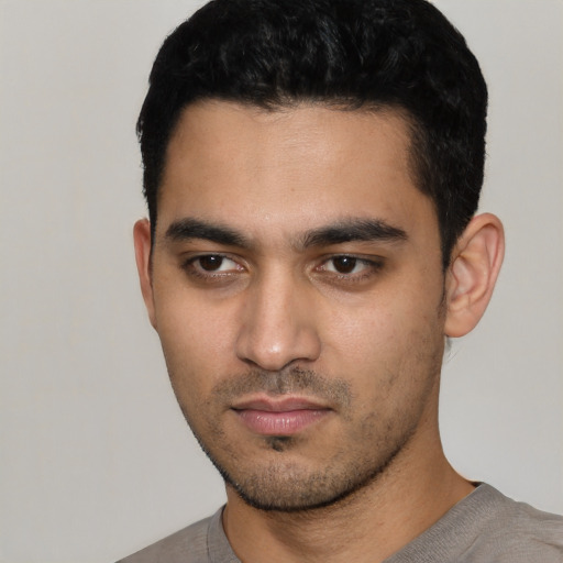 Neutral latino young-adult male with short  black hair and brown eyes