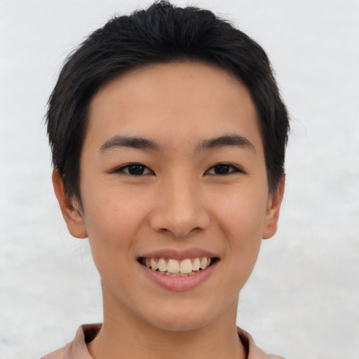 Joyful asian young-adult female with short  black hair and brown eyes