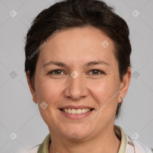 Joyful white adult female with short  brown hair and grey eyes